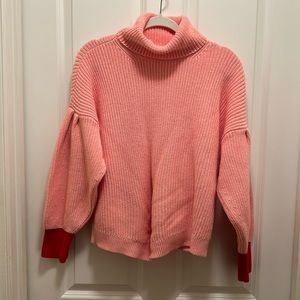 Drop shoulder light pink and red turtleneck sweater